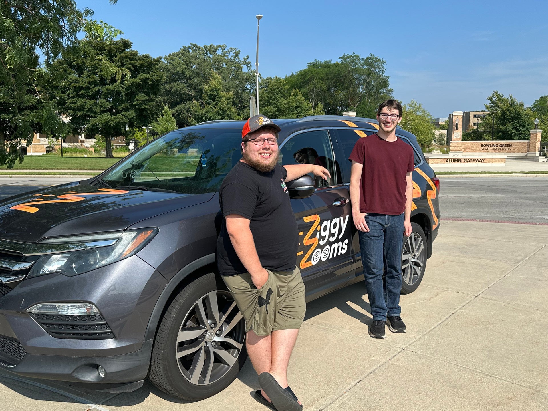 Tyler Baum and Ewen Warman standing in front of the ZWagon.